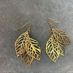 Gold tone three dangling leaf earrings